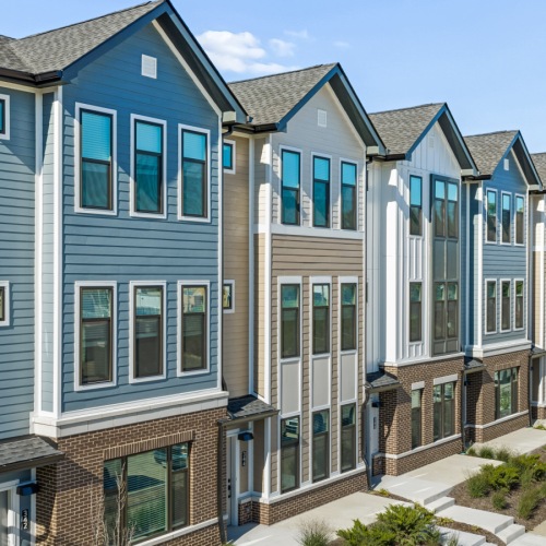 row of colorful townhomes