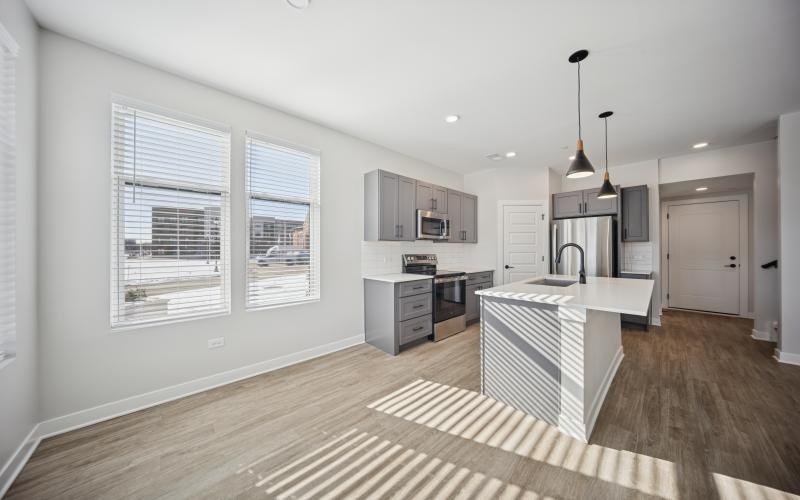 a kitchen with white cabinets