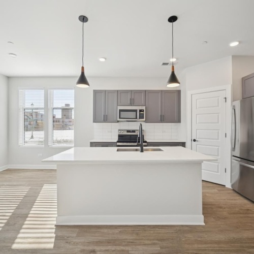 a kitchen with white cabinets