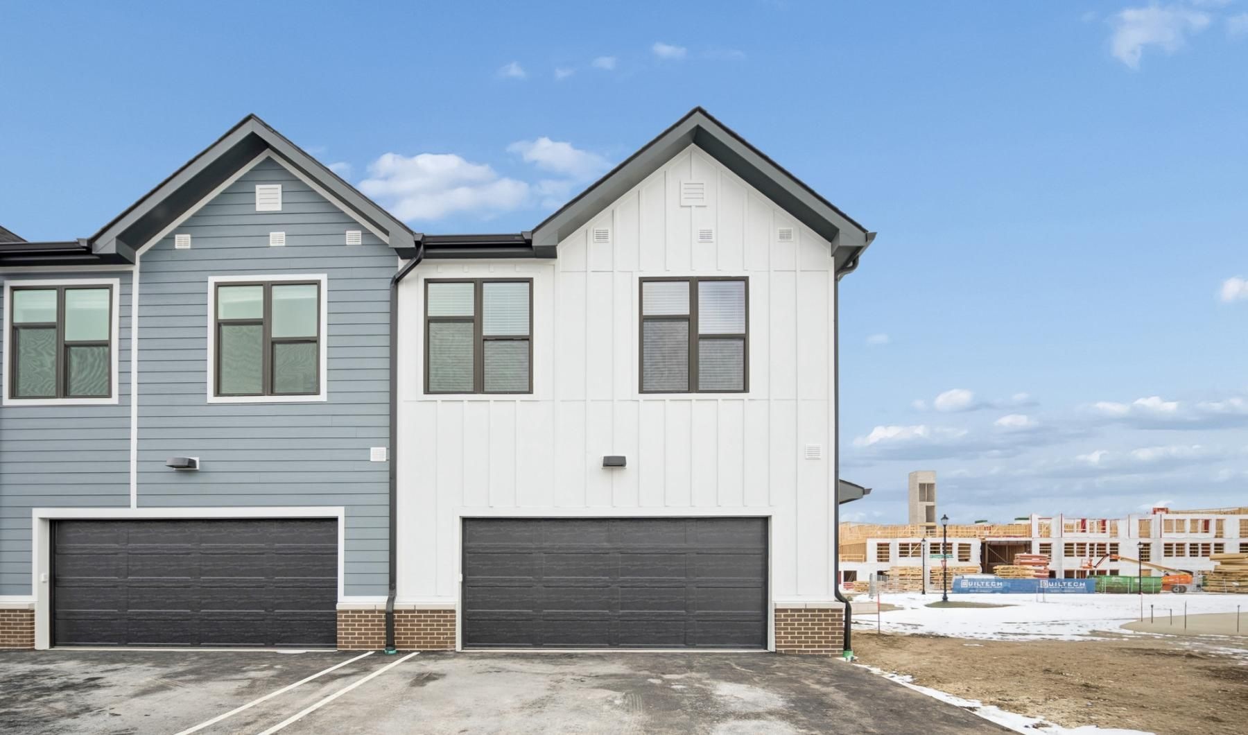 a white building with a garage